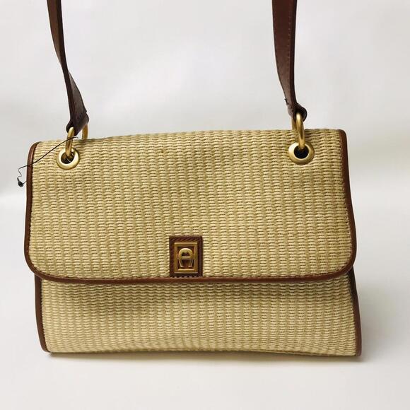 Vintage Etienne Aigner Straw Bag with leather trim and gold toned hardware. - Picture 1 of 4